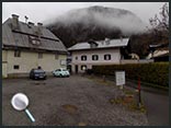 The view from the woodshed outside which Smith finds Jock's body. Villa Egger is the building on the right.