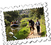 The horse-drawn Tivertonian wends its way along the peaceful Grand Western Canal