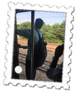 Travelling again on the Chennai Suburban train was a joy. A sign above this chap's head warns that travelling on the roof is a punishable offence