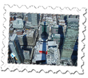 The CN Tower's shadow looms over Toronto beneath its observation deck
