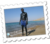 Covered in mud on the Jordanian side of the Dead Sea