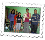 Pooja and friends with their 17 year old dog, Nathu - there's also a pet pigeon in the picture...