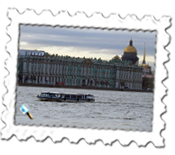A river boat on the River Neva with the Hermitage and St Isaac's cathedral in the background